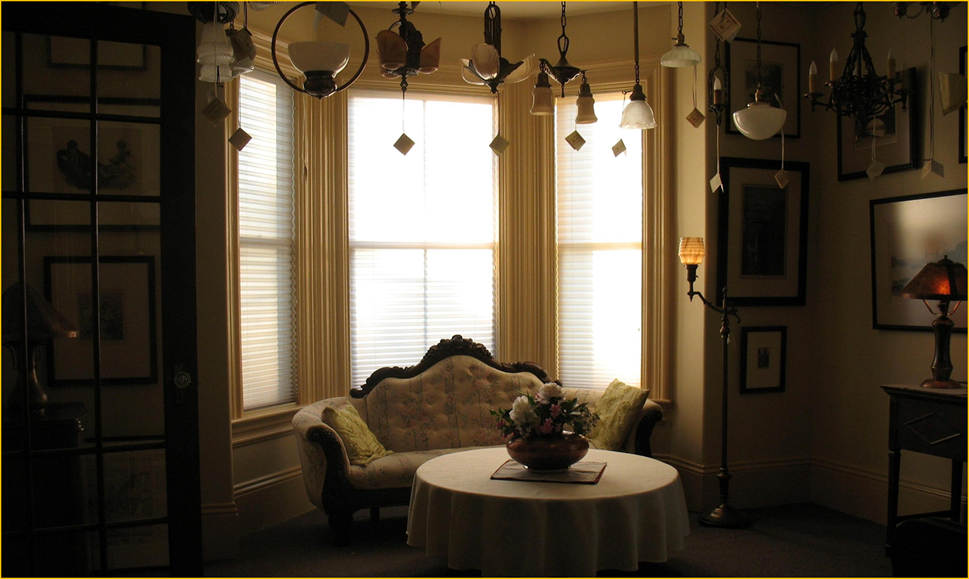 Title: Antiques Annapolis Royal Past Favourites - Description: Interior of Harris House Antique Lighting showing an assortment of antique light fixtures and lamps now sold.